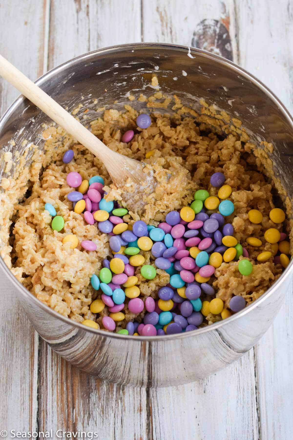 Perfect Rice Krispie Treats in mixing bowl with wooden spoon