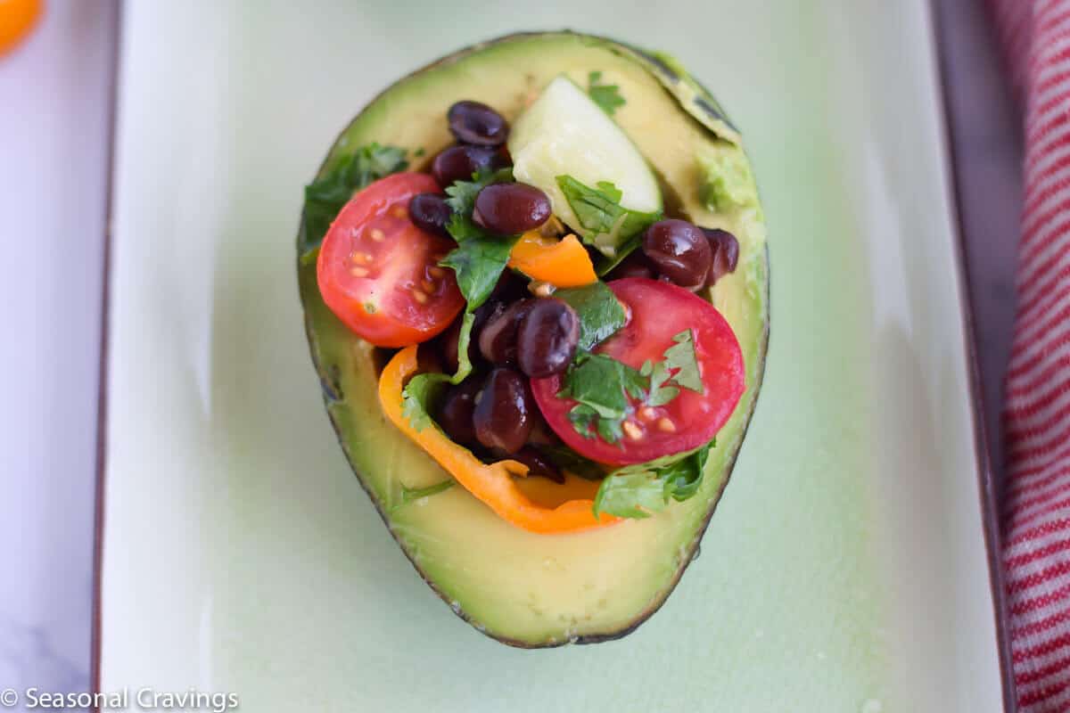 Skinny Cucumber and Tomato Salad in an avocado