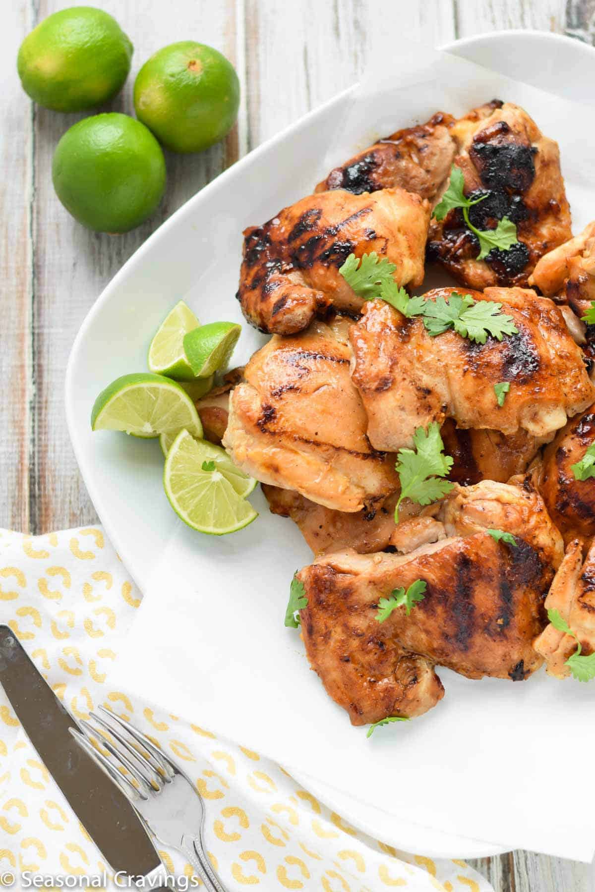 Ginger Honey Glazed Chicken with fresh lime and parsley on a white plate