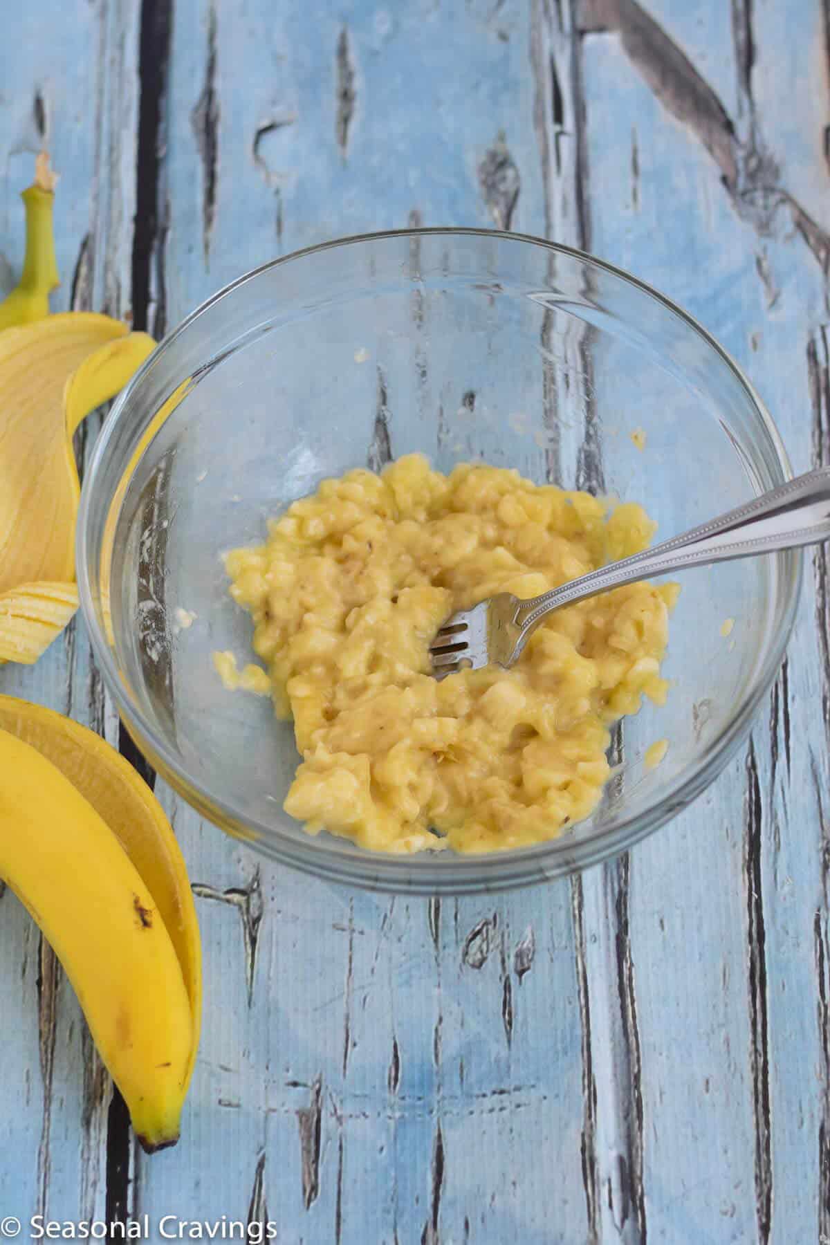 Gluten Free Breakfast Cookies smashed bananas in a bowl