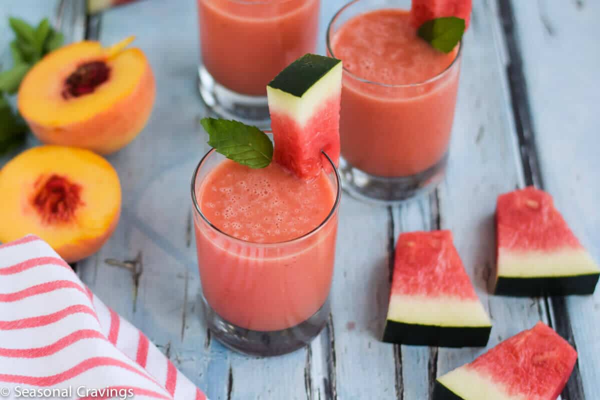 Watermelon Peach Smoothie in glass with peaches on side