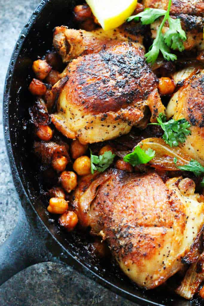 Harissa Chicken with chickpeas in a cast iron skillet