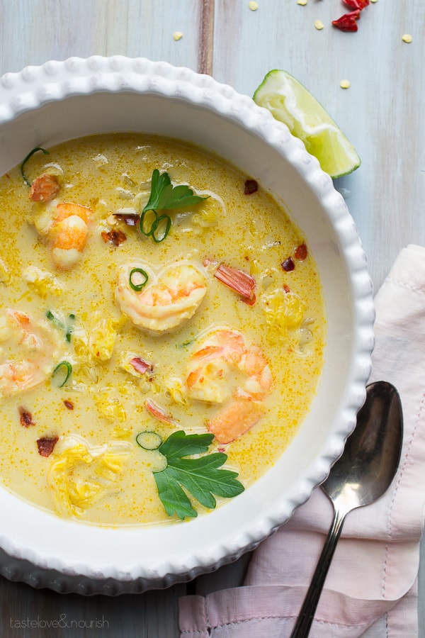 Thai Coconut Shrimp Soup with parsley in a white bowl