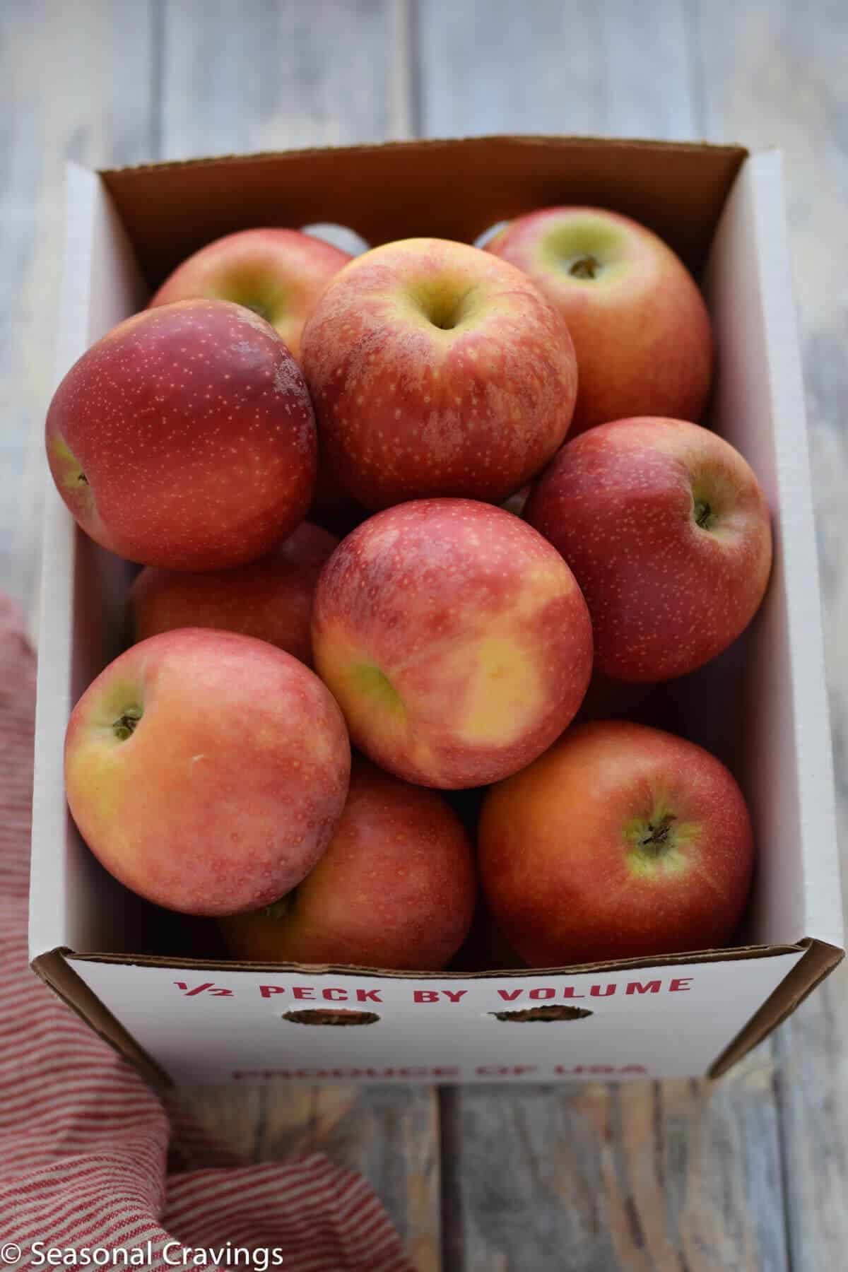 box of fresh red apples