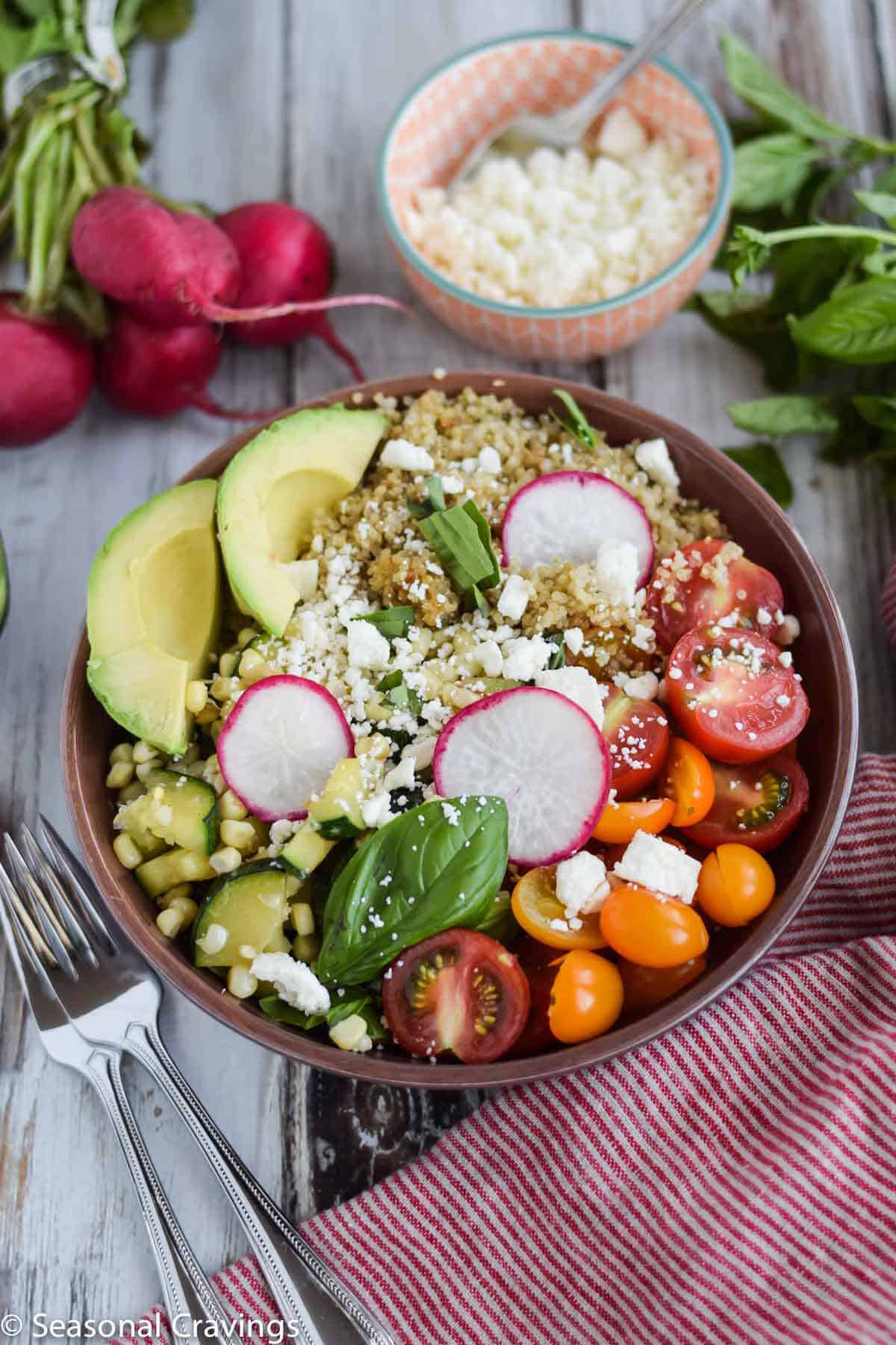 Late Summer Quinoa Grain Bowl with radishes, avocado, tomatoes and zucchini