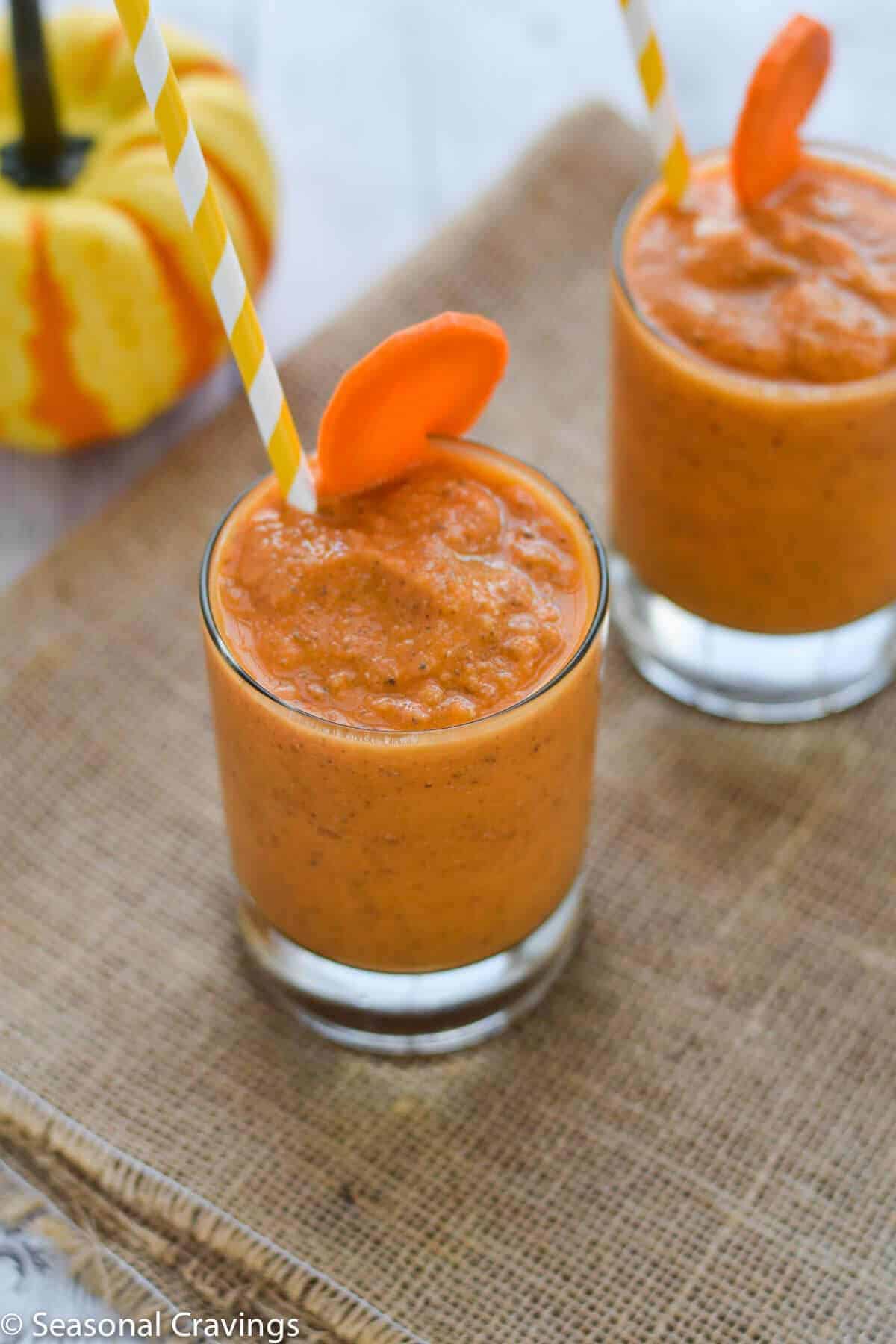 Mango Carrot Chia Smoothie fresh, healthy and delicious breakfast with straw and carrot garnish