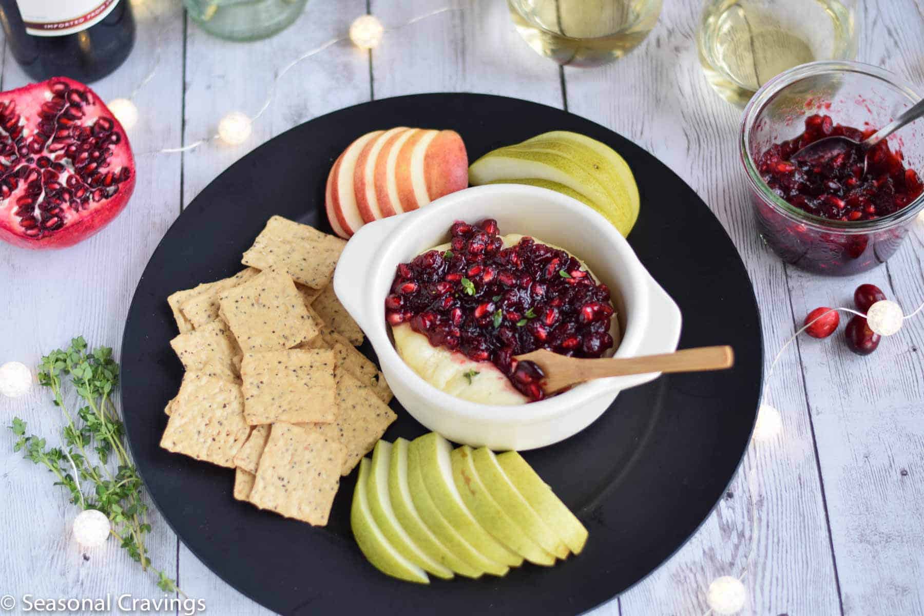 Pomegranate Cranberry Baked Brie is the perfect sweet and salty appetizer for any party.