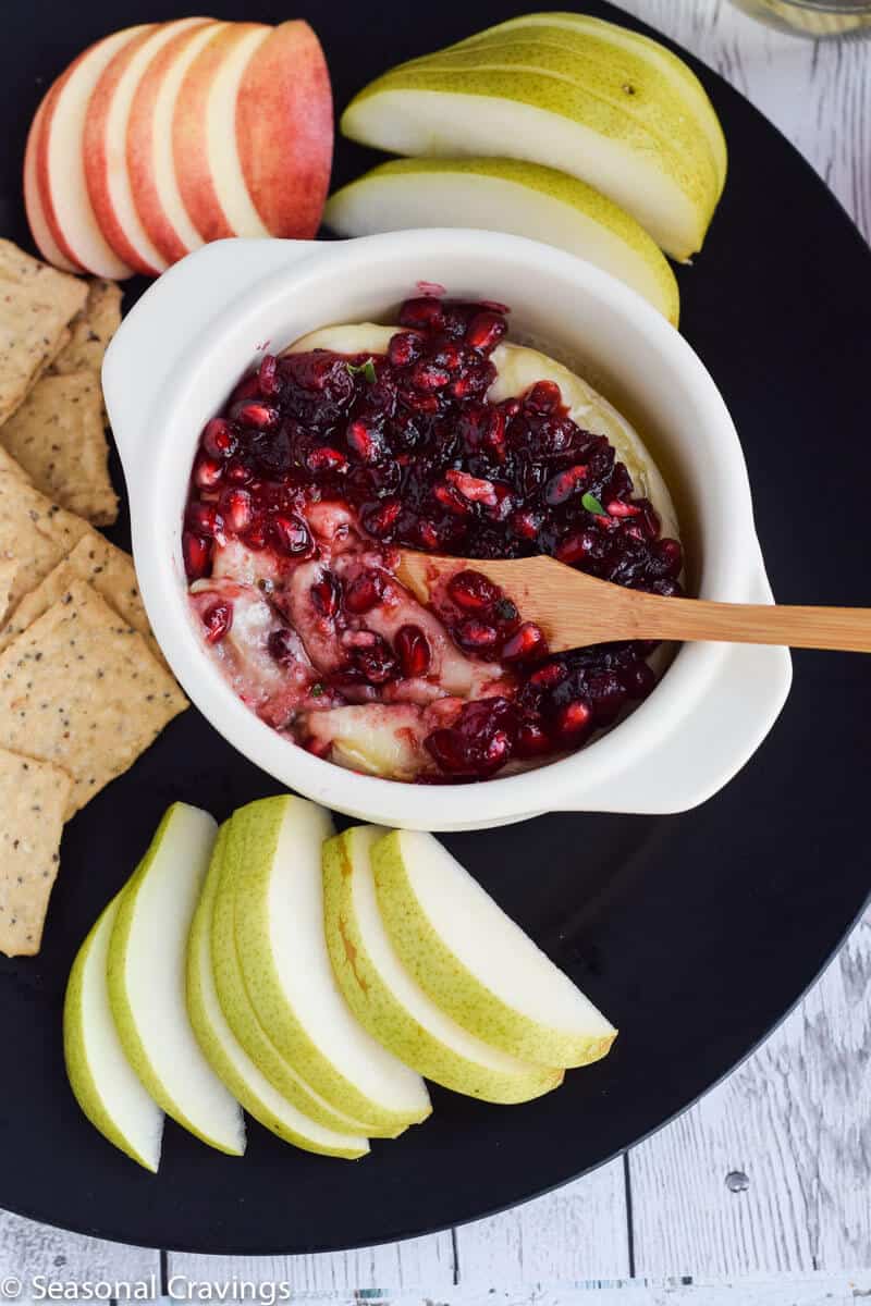 Pomegranate Cranberry Baked Brie is the perfect sweet and salty appetizer for any party.