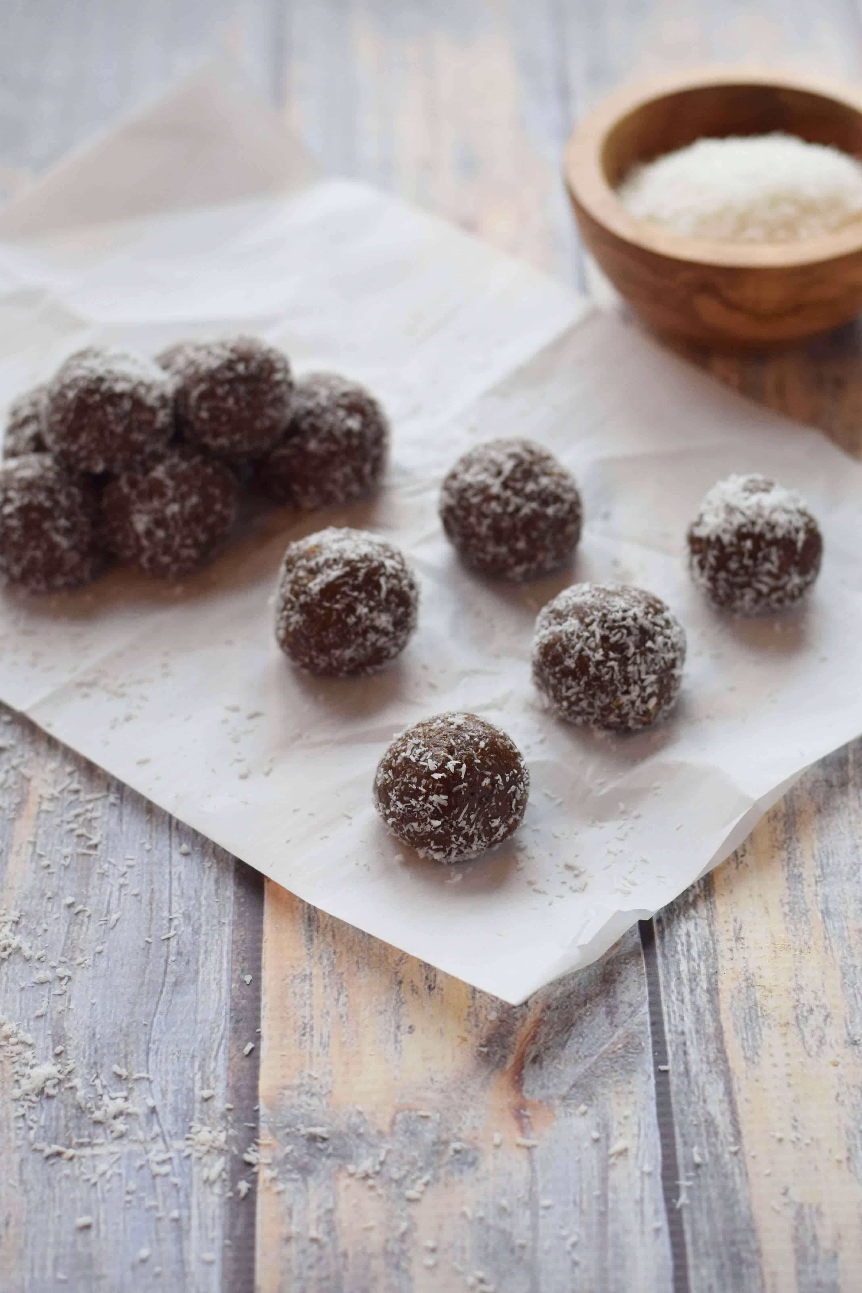 Chocolate Almond Butter Protein Balls on parchment paper