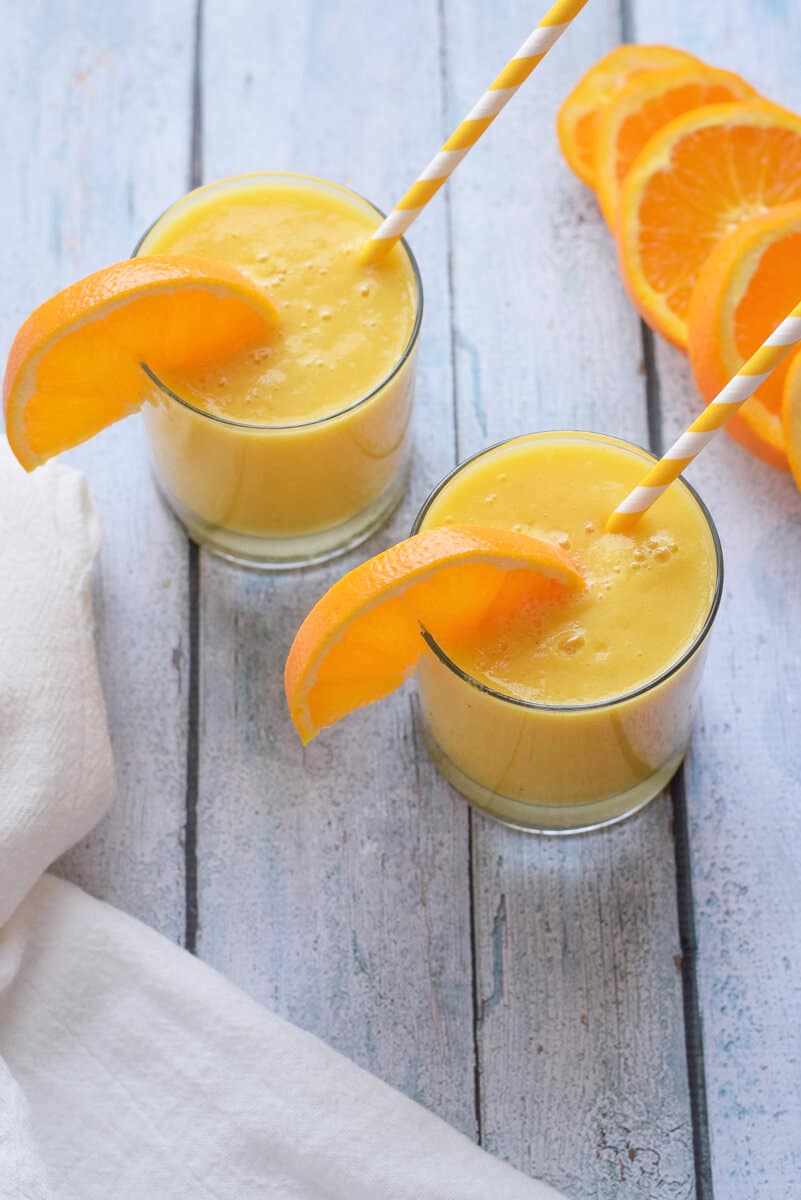 Cold Buster Citrus Smoothie two glasses with orange garnish