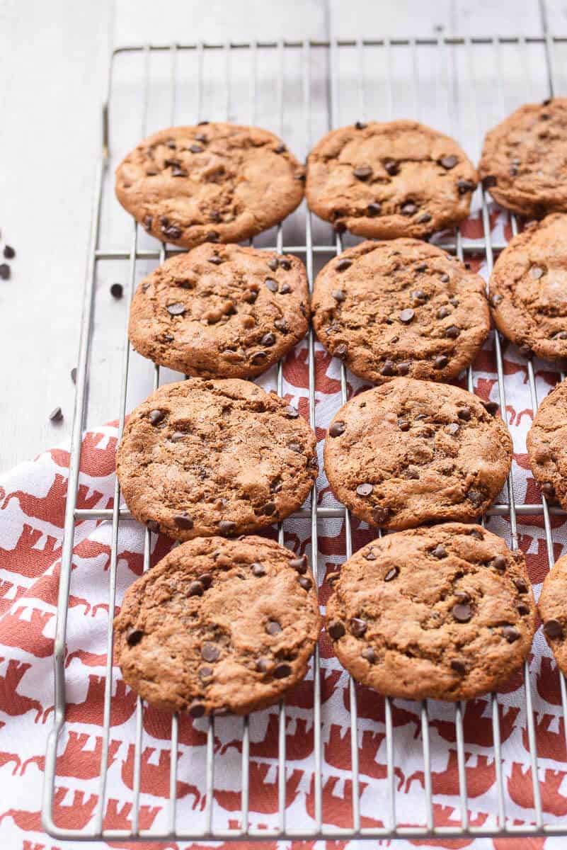 flourless chocolate chip cookies on a cooling rack