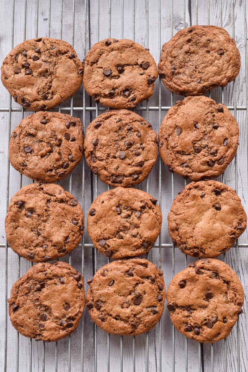 flourless chocolate chip cookies with almond butter on a cooling rack