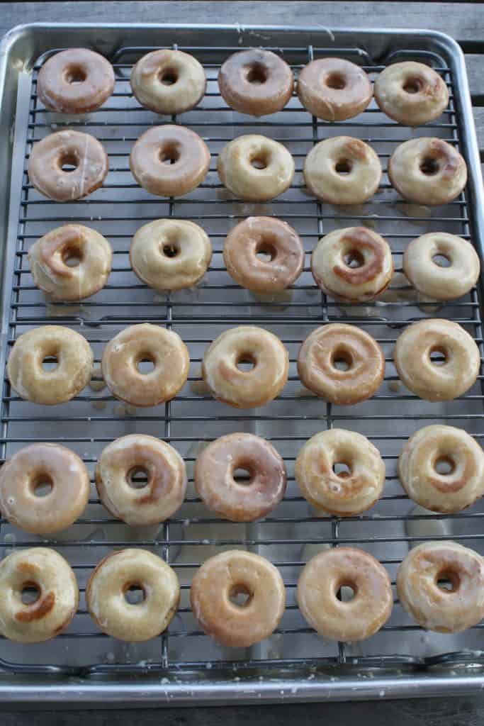 gluten free vanilla cake donuts on a cooling rack