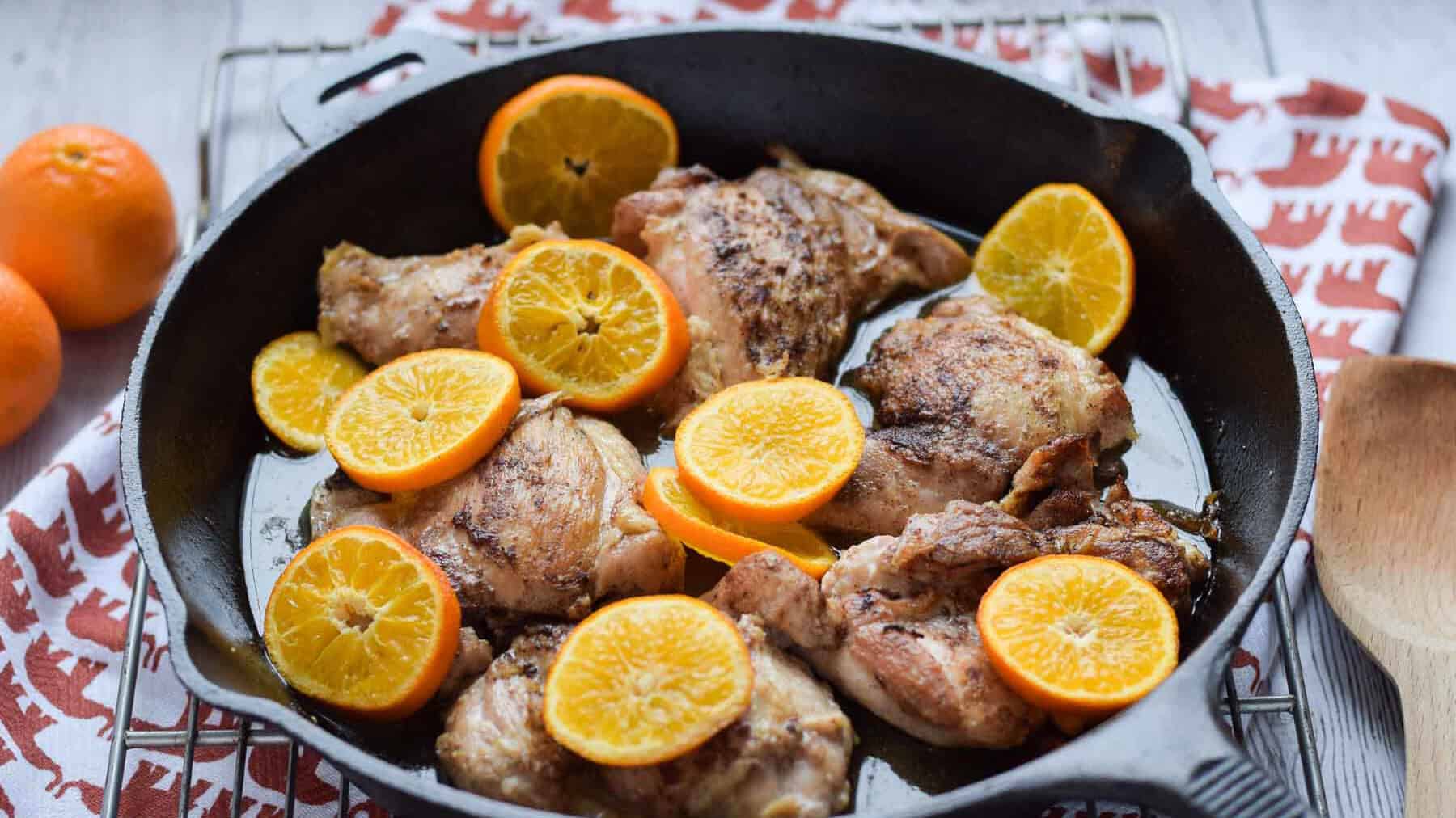 Roasted Clementine Five Spice Chicken in a cast iron skillet.