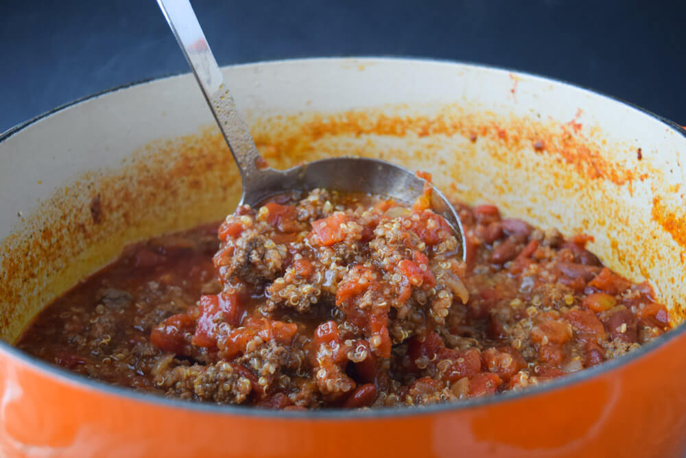 Skinny Quinoa Chili in a ladle