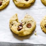 Close up of chocolate chip cookie on parchment paper