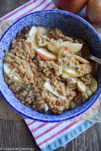 Gluten-free apple crisp in a blue and white bowl.