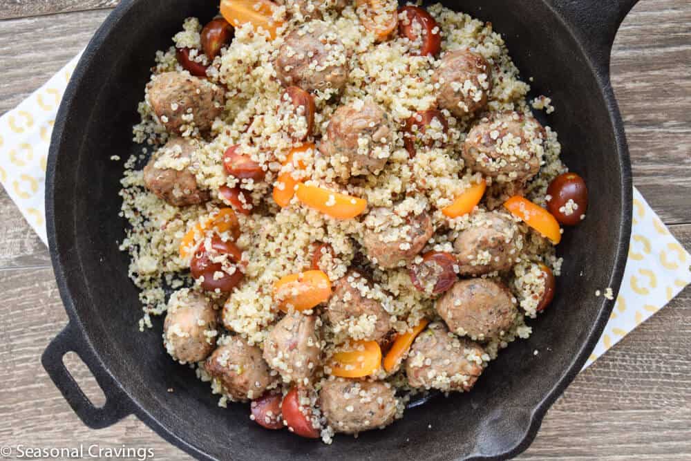 meatballs and quinoa in a skillet overhead shot