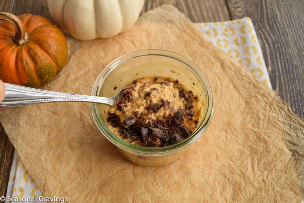 Overnight Pumpkin Oats in a bowl with a spoon