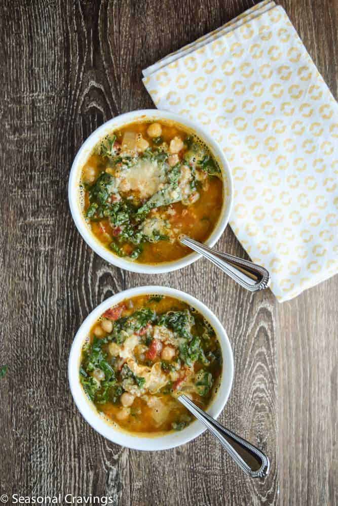 Tuscan Chickpea Soup with Kale in two white bowls with spoons
