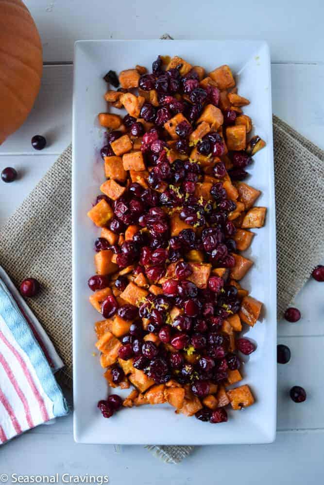 Roasted Maple Sweet Potatoes with Cranberries on a white plate