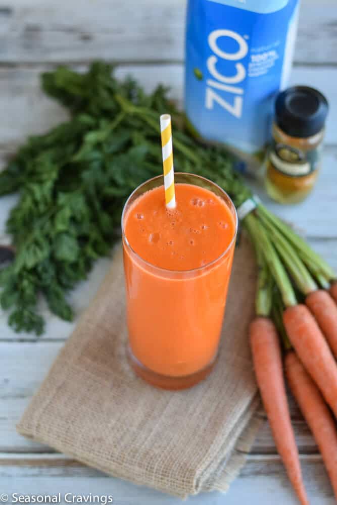 Carrot, Apple and Turmeric Smoothie on a burlap cloth