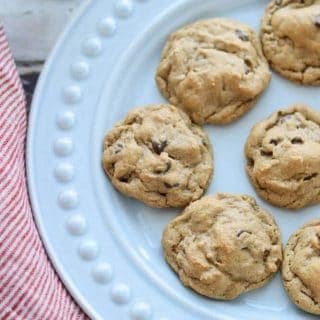 Five Ingredient Peanut Butter Chocolate Chip Cookies on a plate with a glass of milk.