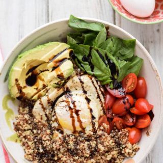 A Quinoa Breakfast Bowl with Egg, Tomatoes and Avocado.
