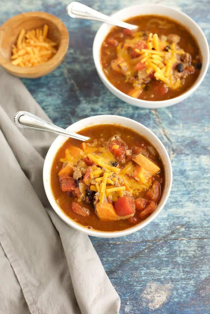 healthy turkey chili with cheese and spoons