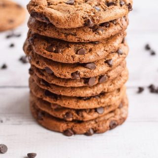 A stack of grain-free chocolate chip cookies on a white background.