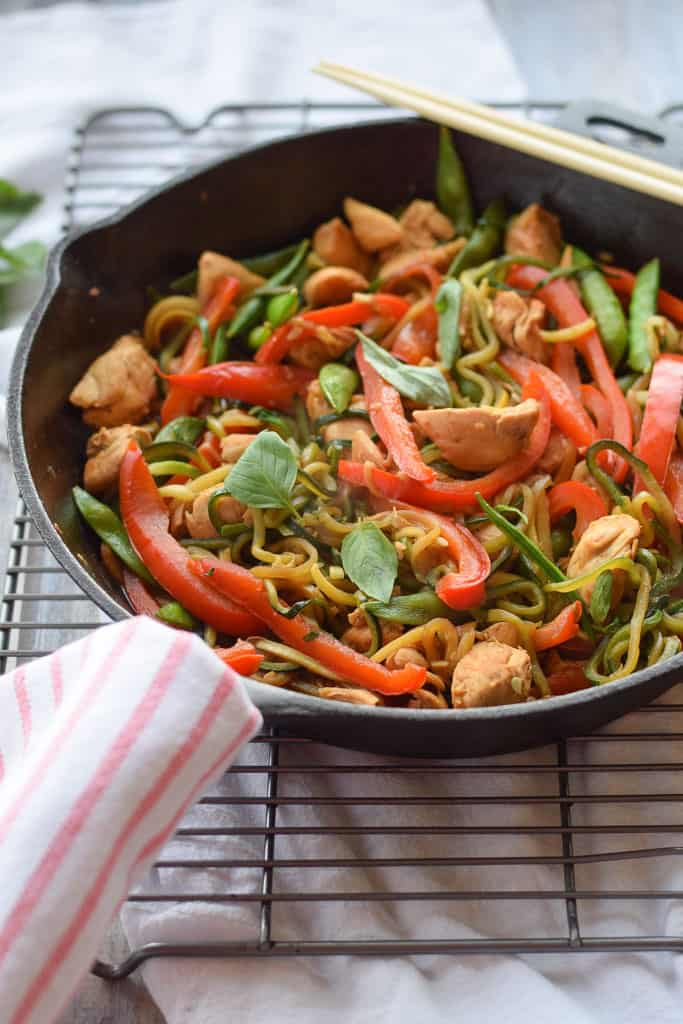 Chicken Thai Basil with Zucchini Noodles - Full of red peppers, sugar snap peas, stir fried chicken and a savory sauce over zucchini noodles.{gluten free, paleo, whole30}