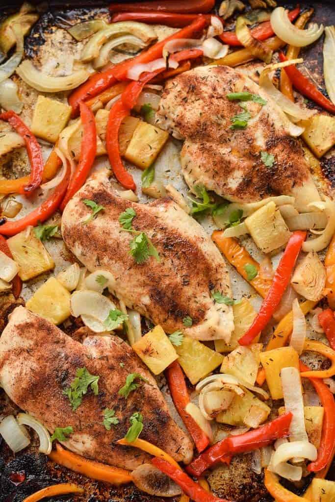 jerk chicken on a sheet pan with vegetables