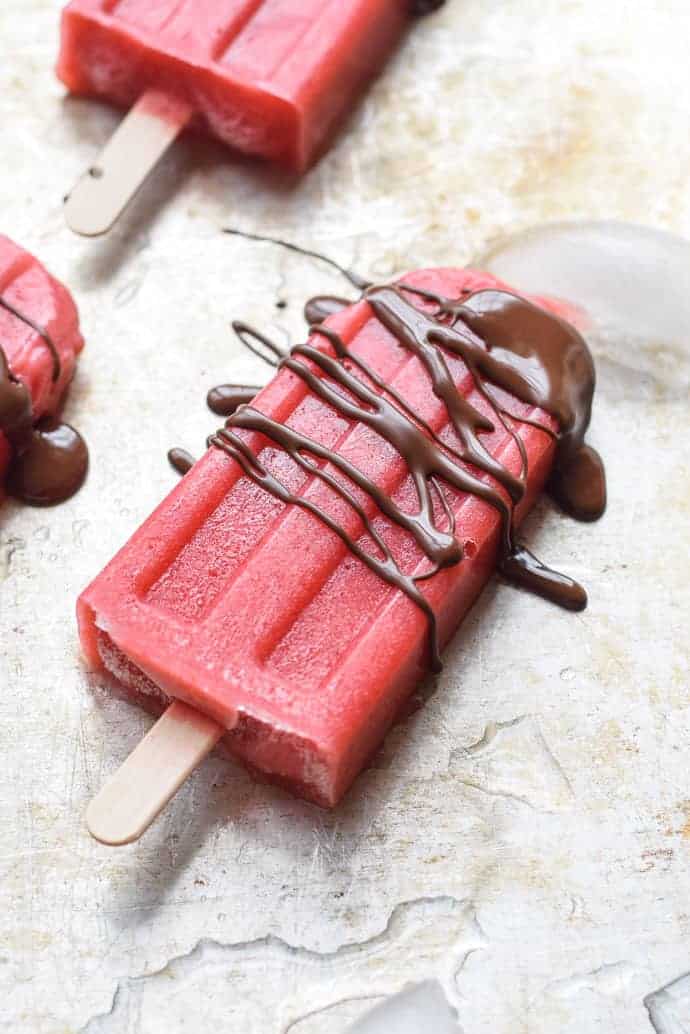 Strawberry Popsicles with Chocolate Drizzle are the perfect healthy summer treat.