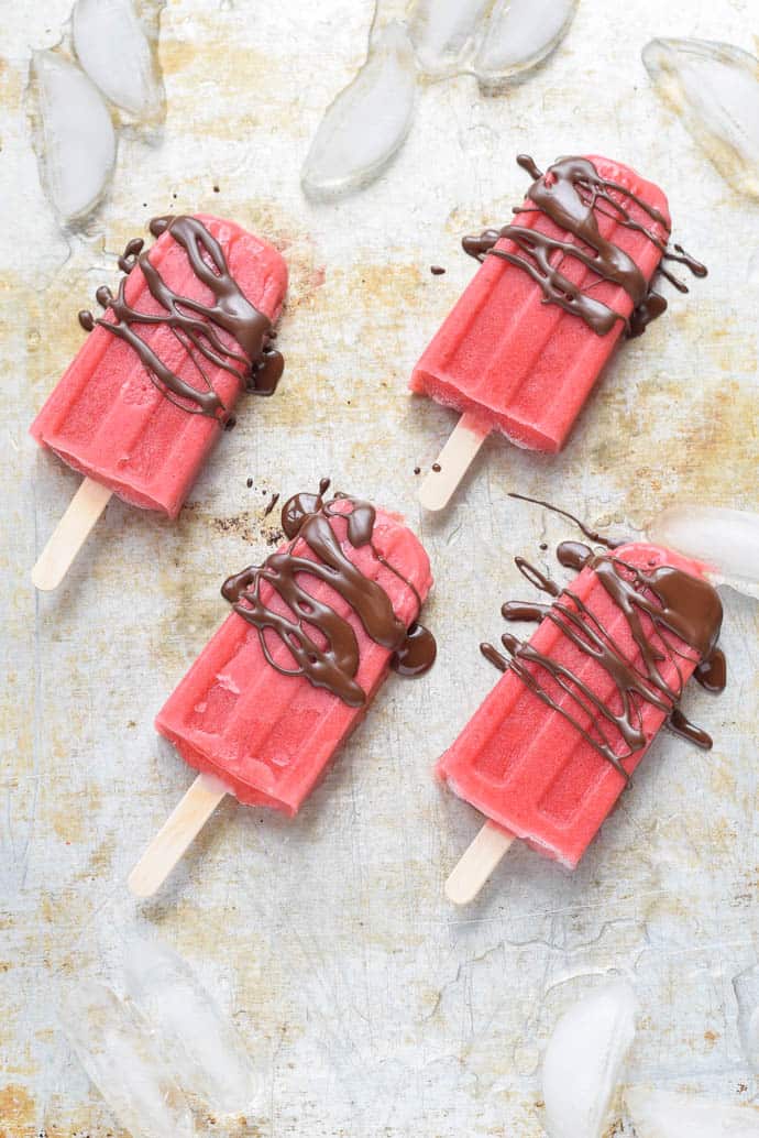 Strawberry Popsicles with ice and chocolate