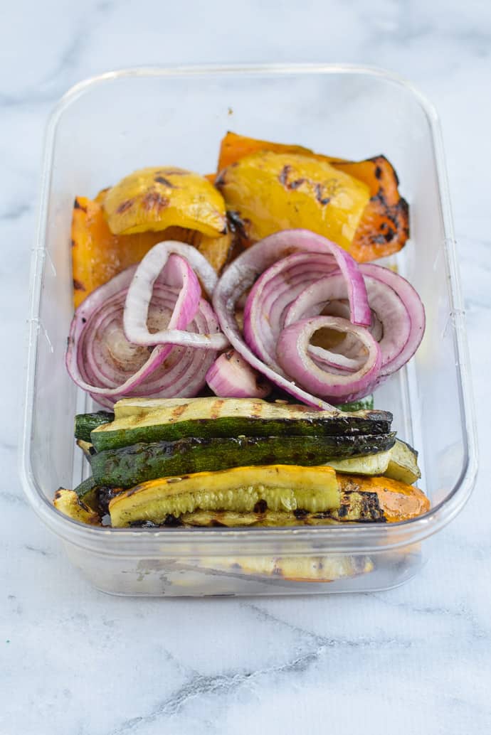roasted vegetables in a clear container