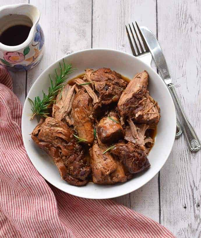 Instant Pot pork tenderloin in a white bowl.