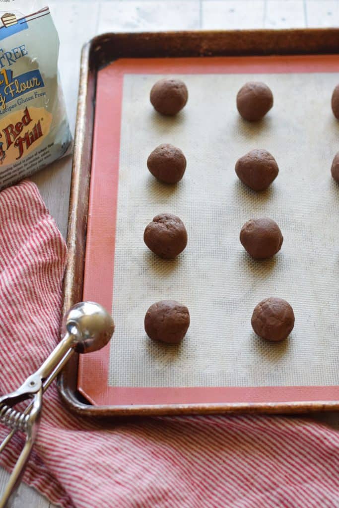 Gluten Free Chocolate Thumbprint Cookies on a sheet pan