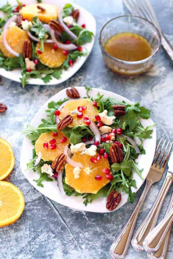 Arugula and Orange Salad on white plates