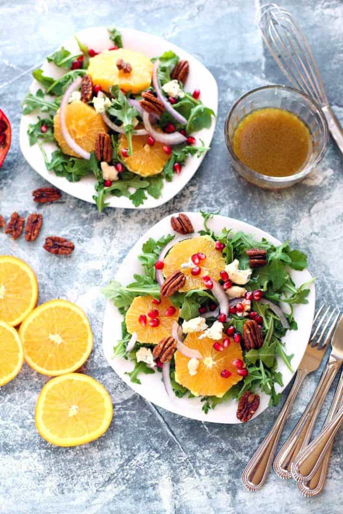 Arugula and Orange Salad on two white plates