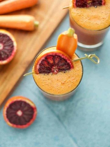 Blood Orange, Carrot and Turmeric Smoothie with carrot and blood orange garnish