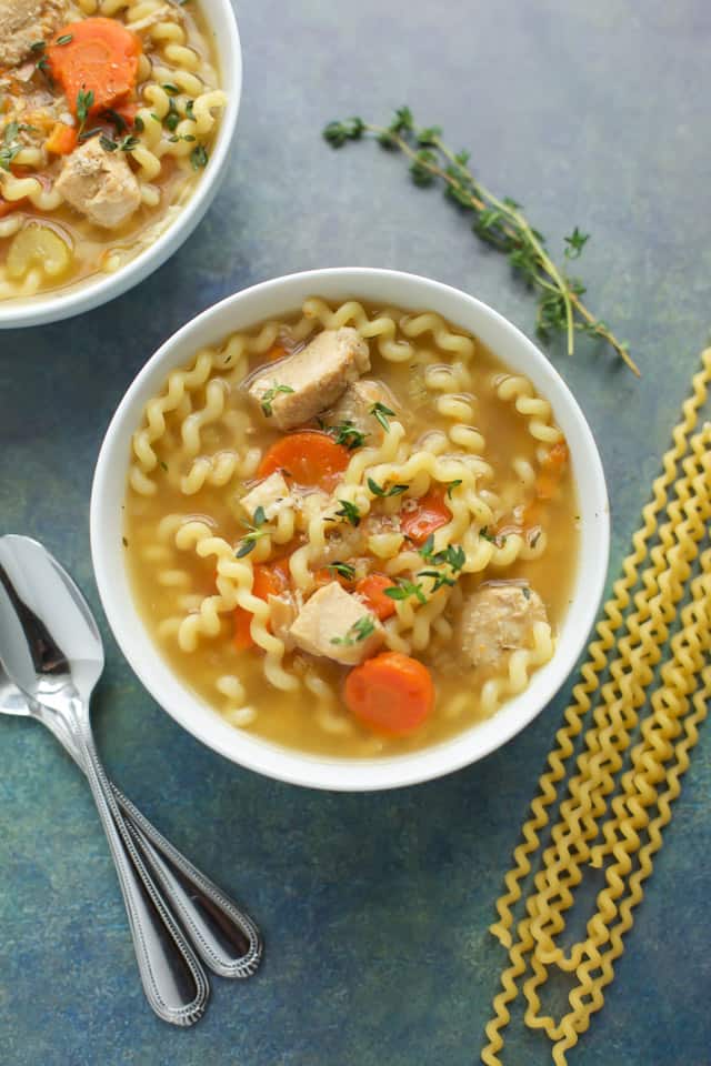  Instant Pot Chicken Soup in a white bowl with pasta