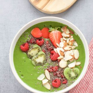 Green Smoothie Bowl with Raspberries full of kale, kiwi and berries