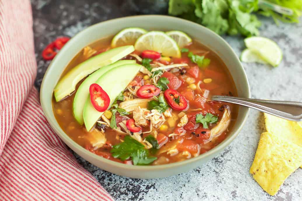 Easy Instant Pot Chicken Tortilla Soup is full of vegetables, chicken and spice. #glutenfree