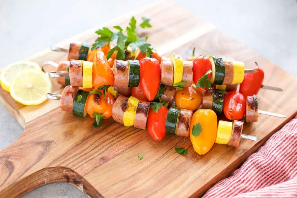 Chicken Sausage Skewers with Vegetables on a cutting board