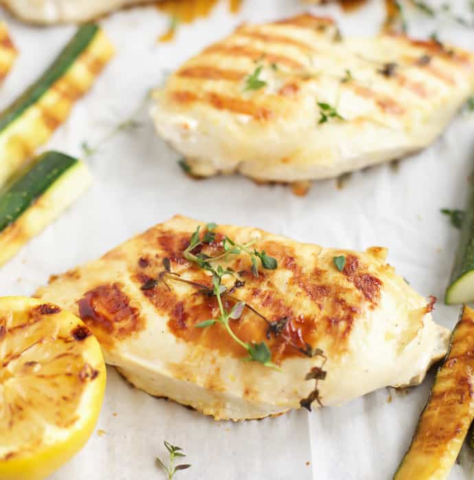 Grilled lemon thyme chicken with grilled zucchini on a sheet pan