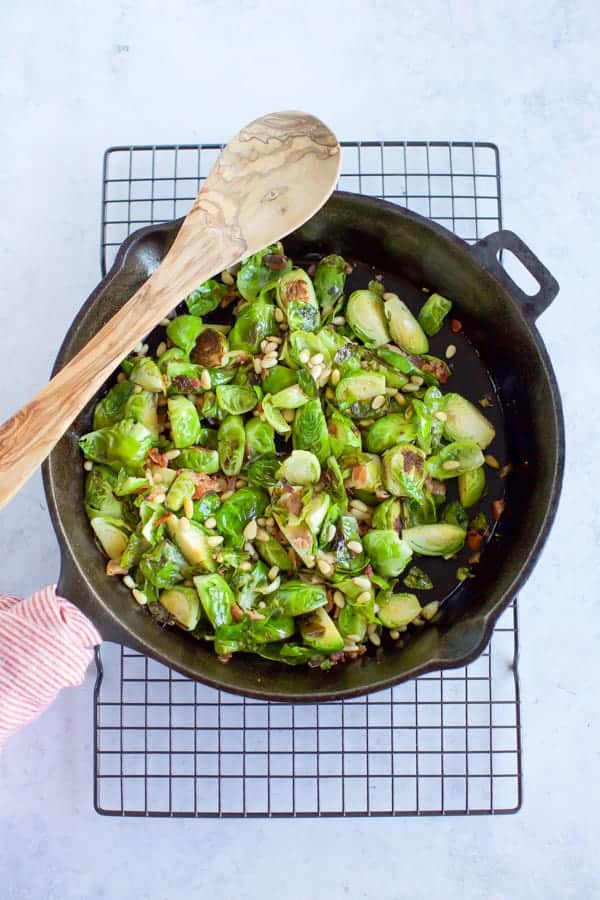 Sauteed Brussels Sprouts in a cast iron pan