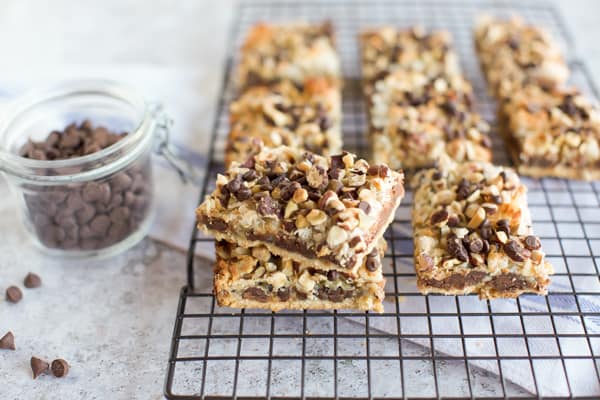 Gluten Free Seven Layer Bars stacked on a cooling rack