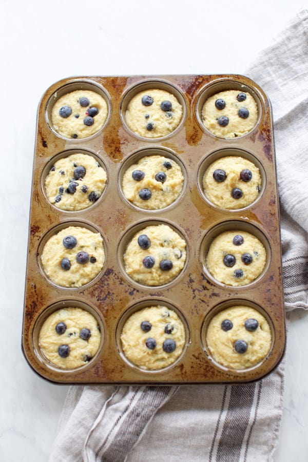 almond flour blueberry muffins in a muffin tin