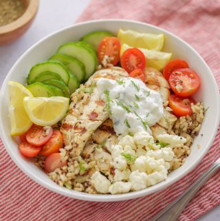 A flavorful Chicken Gyro Bowl with tender chicken, juicy tomatoes, and crisp cucumbers.