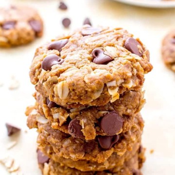 A stack of 10 oatmeal cookies with chocolate chips.
